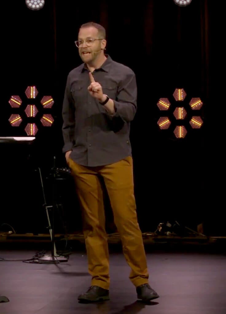 sam speaking on stage